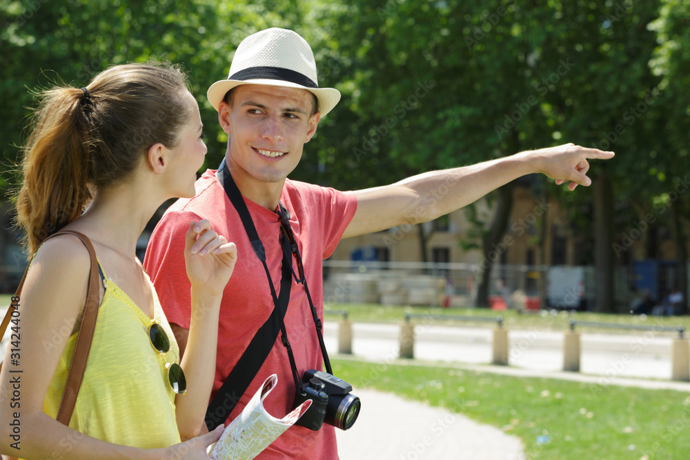 tourist couple in city read map tourist couple in city read map