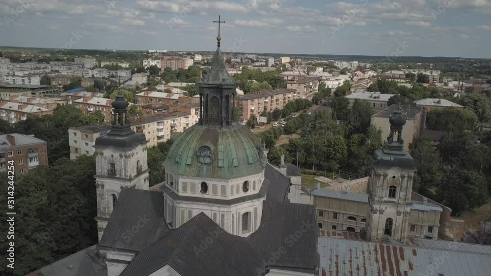 Berdychiv, Ukraine - 7 8 2019: Roman Catholic Church of the Blessed Virgin Mary. Aerial photography from a drone or quadrocopter of the monastery of Carmelite monks. The main sanctuary with defensive Berdychiv, Ukraine - 7 8 2019: Roman Catholic Church of the Blessed Virgin Mary. Aerial photography from a drone or quadrocopter of the monastery of Carmelite monks. The main sanctuary with defensive