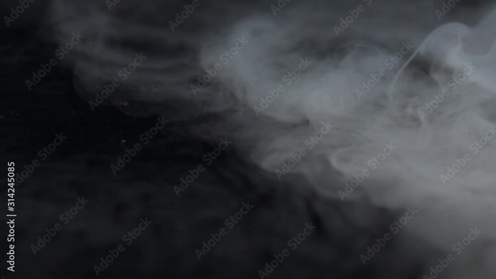 dry ice evaporation on a black background dry ice evaporation on a black background