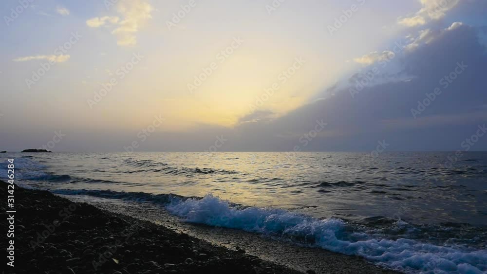Sunrise in the Kamari beach in Santorini, Greece. Sunrise in the Kamari beach in Santorini, Greece.