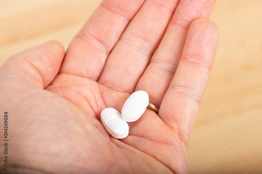 Medicine : tablets in the hand of a man Medicine : tablets in the hand of a man