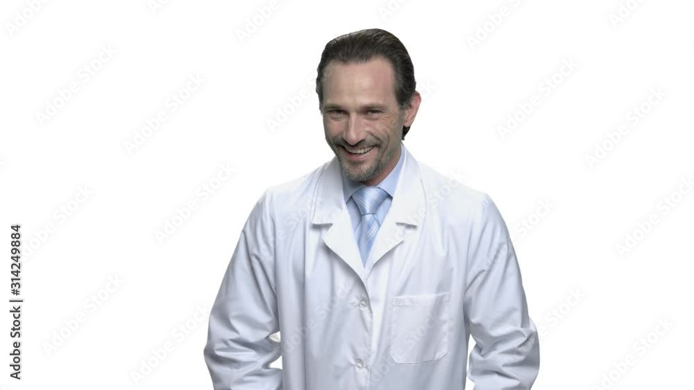 Laughing mature doctor on white background. Mature scientist or lab technician in white robe. Human positive expression. Laughing mature doctor on white background. Mature scientist or lab technician in white robe. Human positive expression.