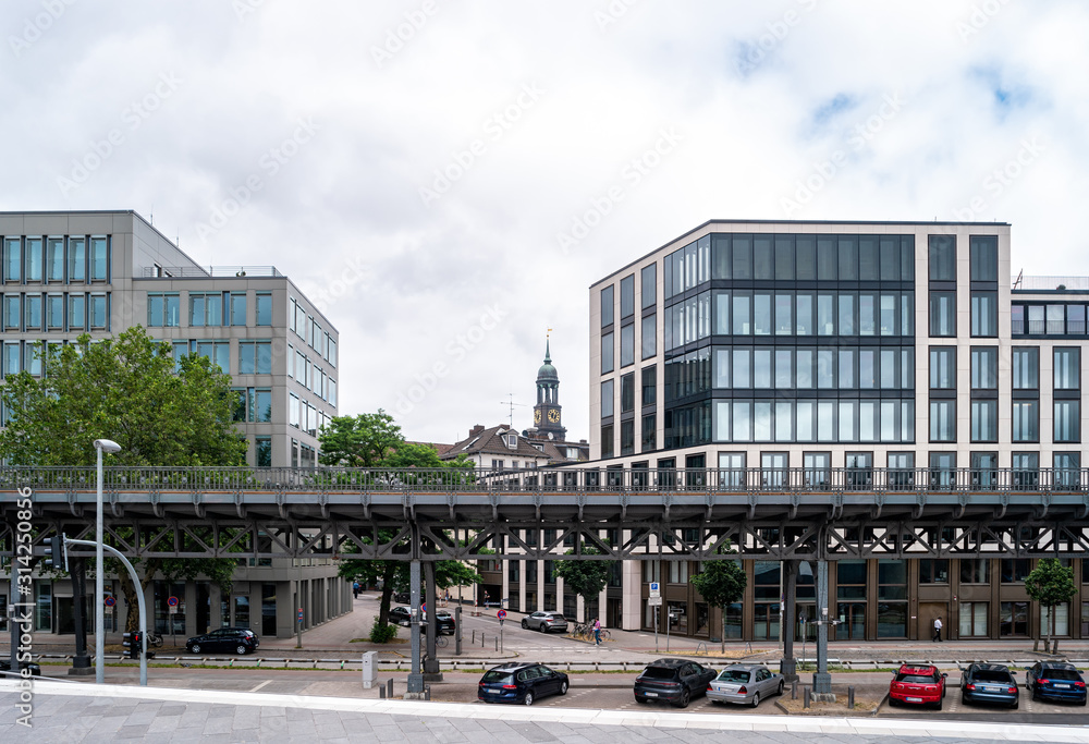 Street view of Hamburg city in the business quarter. Сlock tower of St. Michael's Church, Germany.