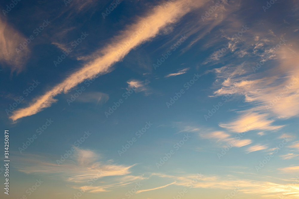 blue sky with white clouds beautifully lit by the sun as a background blue sky with white clouds beautifully lit by the sun as a background