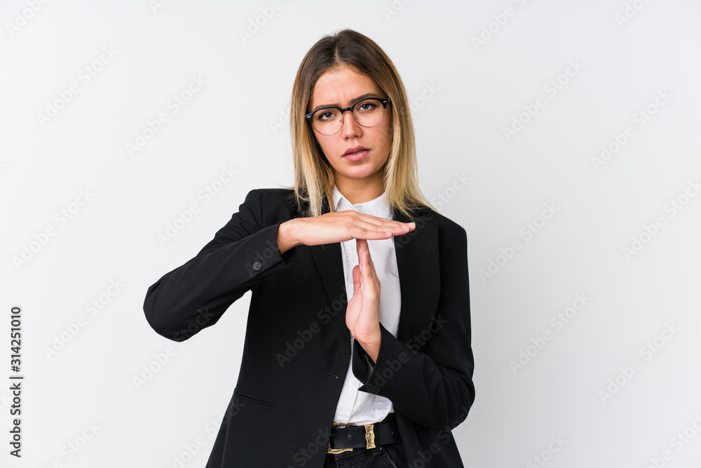 Young business caucasian woman showing a timeout gesture. Young business caucasian woman showing a timeout gesture.