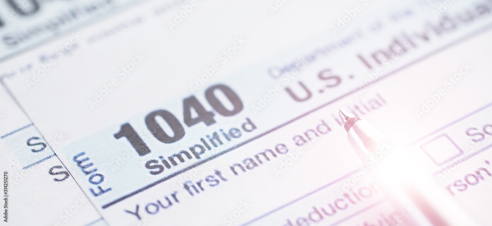 Annual tax reporting. Tax form on the table. Financial statements for signature. Annual tax reporting. Tax form on the table. Financial statements for signature.