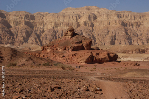 The famous Timna National Park in the desert in southern Israel in the Eilat region. Sand cliffs  dry land  red sand in the form of pillars and mushrooms. Sights of Israel.