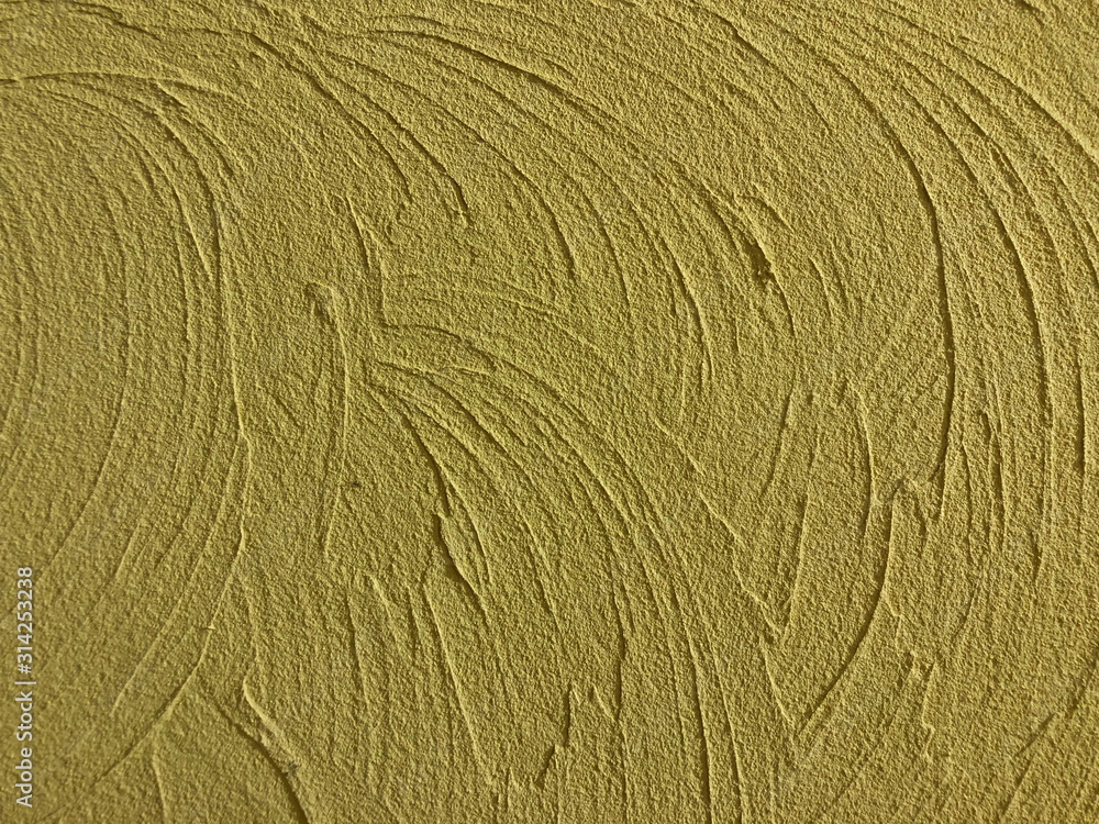 Decorative yellow cement wall background Decorative yellow cement wall background