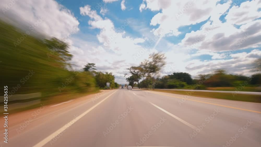 Time-lapse of driving fast speed a car on countryside road Thailand in the day time, POV shot 4k Time-lapse of driving fast speed a car on countryside road Thailand in the day time, POV shot 4k