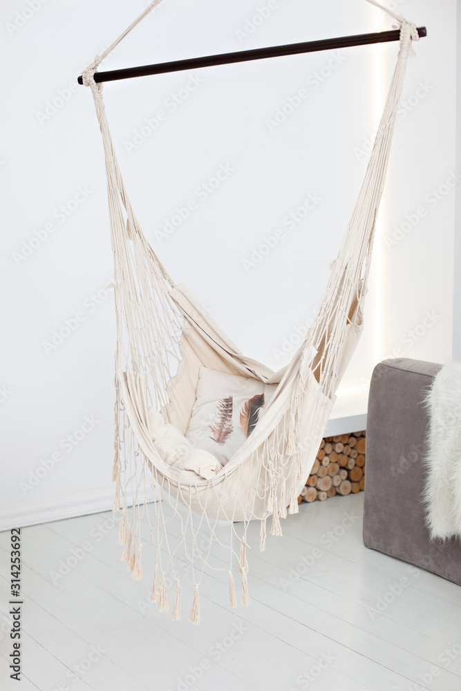 Modern hammock in living room interior. A cozy hammock in a stylish day