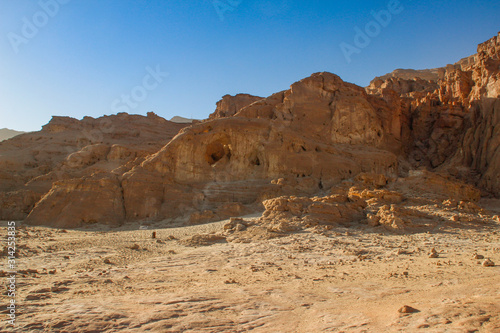 The famous Timna National Park in the desert in southern Israel in the Eilat region. Sand cliffs  dry land  red sand in the form of pillars and mushrooms. Sights of Israel.