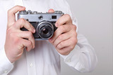 young man holding a camera