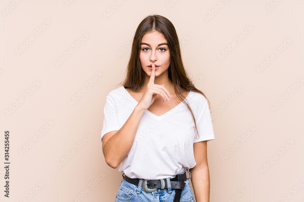 Young caucasian woman posing isolated keeping a secret or asking for silence. Young caucasian woman posing isolated keeping a secret or asking for silence.