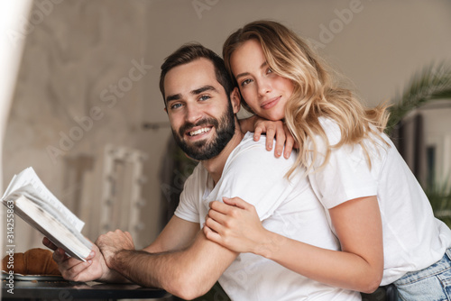Lovely smiling young couple embracing