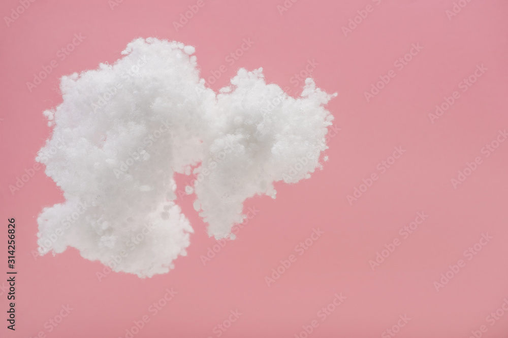 Fototapeta premium white fluffy cloud made of cotton wool isolated on pink