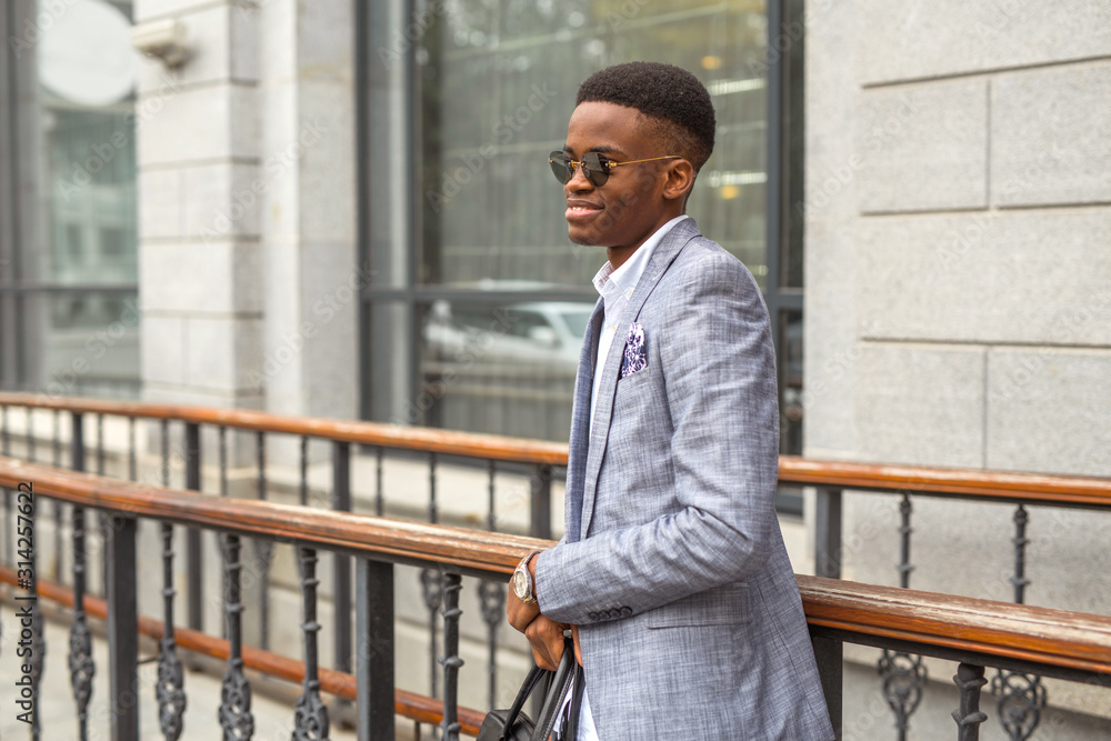 handsome young african man in a suit handsome young african man in a suit