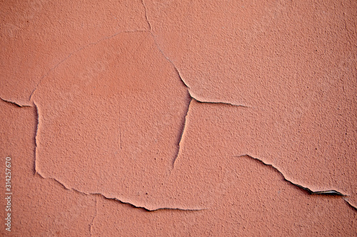 Textured background. Decorative plaster walls. Color with cracks and peeling
