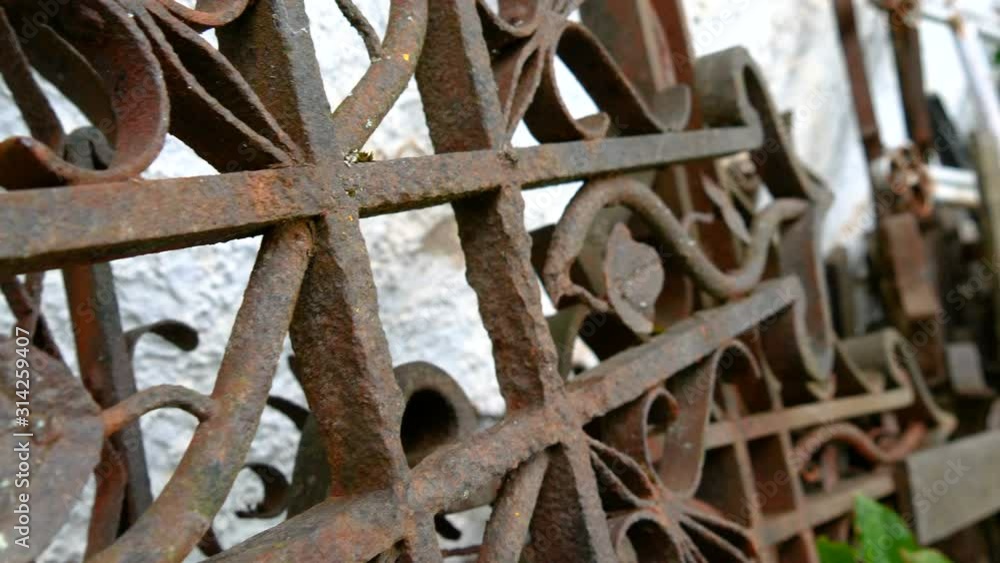 Closer look of the metal cross fence on the wall