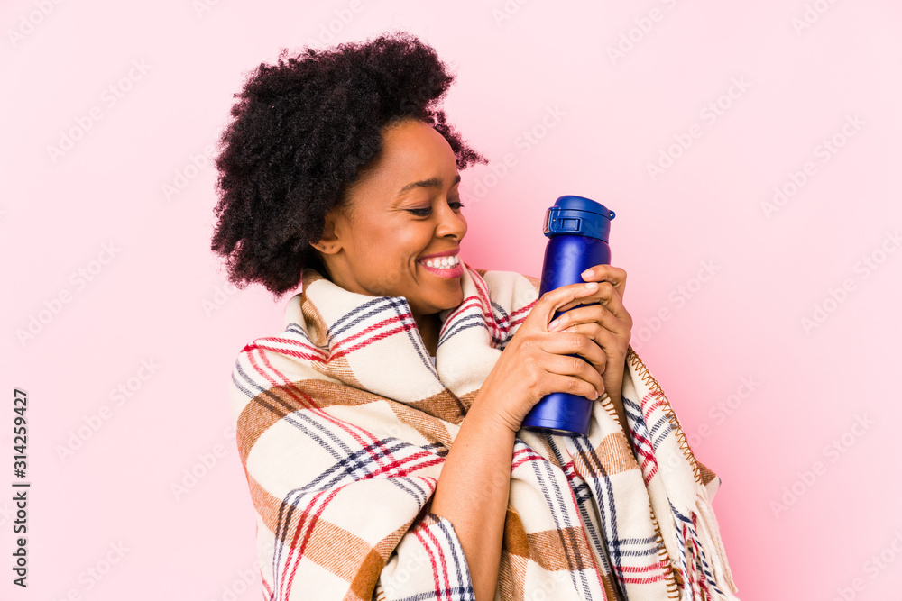 Young african american woman in a camping day isolated