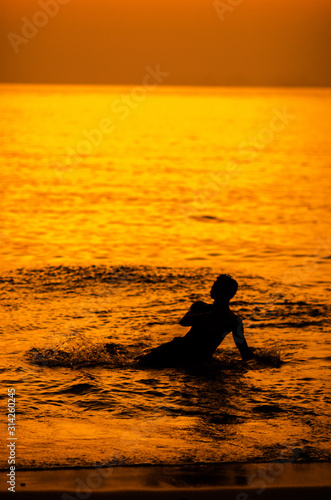Wallpaper Mural silhouette of a man on the beach Torontodigital.ca