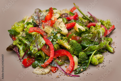Fresh broccoli salad, boiled al dente, red bell pepper, cucumber and flavored...
