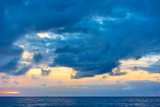 Sky with clouds above the sea after sundown