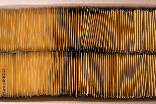 Lot of brown paper postal envelope in cardboard box