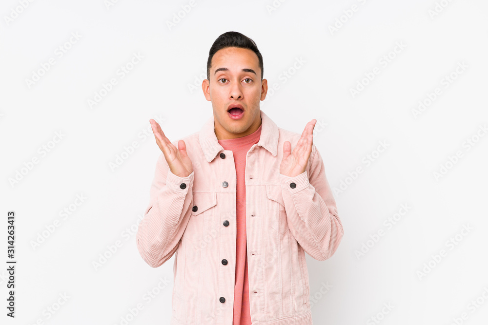 Young latin man posing isolated surprised and shocked. Young latin man posing isolated surprised and shocked.
