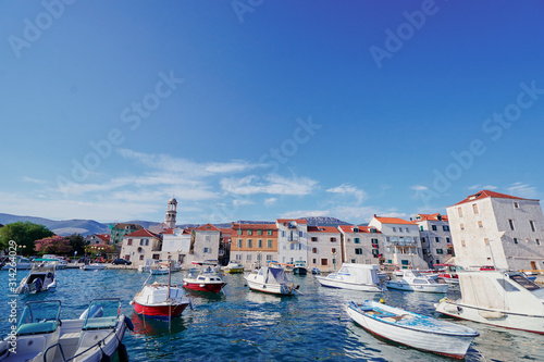 Kastel coast in Dalmatia,Croatia. A famous tourist destination on the Adriatic sea. Fishing boats moored in old town harbor.
