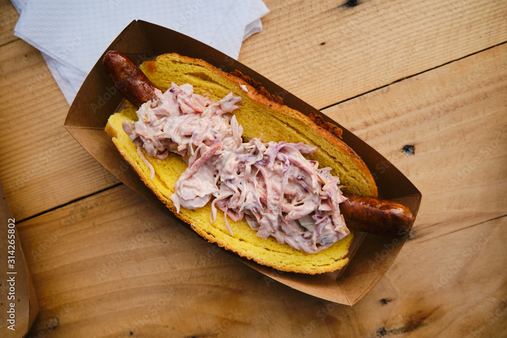 Hot dog sandwich with coleslaw salad, delicious street food
