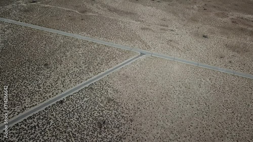 Cinematic Drone Aerial View on Junction of Roads in the Middle of Desert Valley