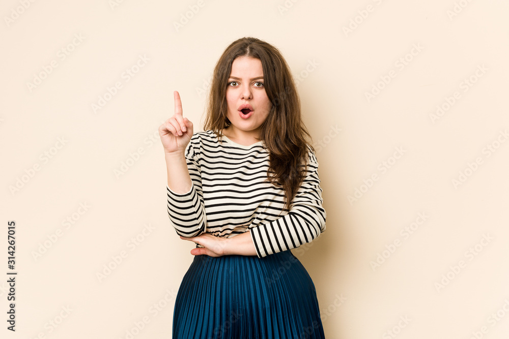 Young curvy woman having some great idea, concept of creativity. Young curvy woman having some great idea, concept of creativity.