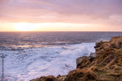 Huge waves breaking at Muckross Head - A small peninsula west of Killybegs, County Donegal, Ireland. The cliff rocks are famous for climbing