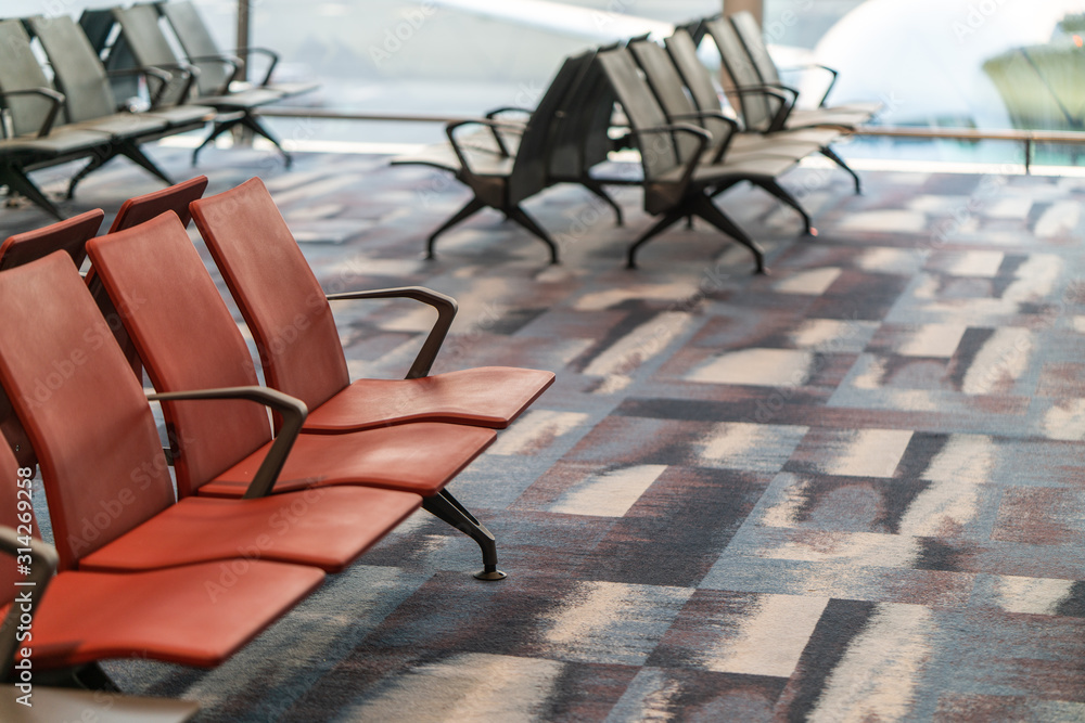 Chairs in modern airport terminal