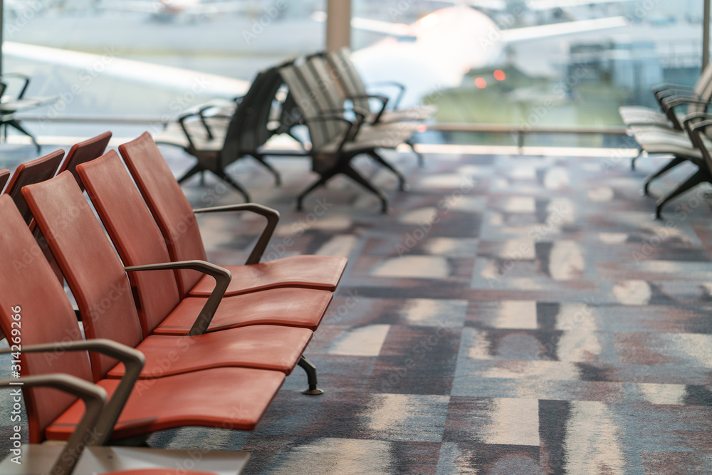 Chairs in modern airport terminal