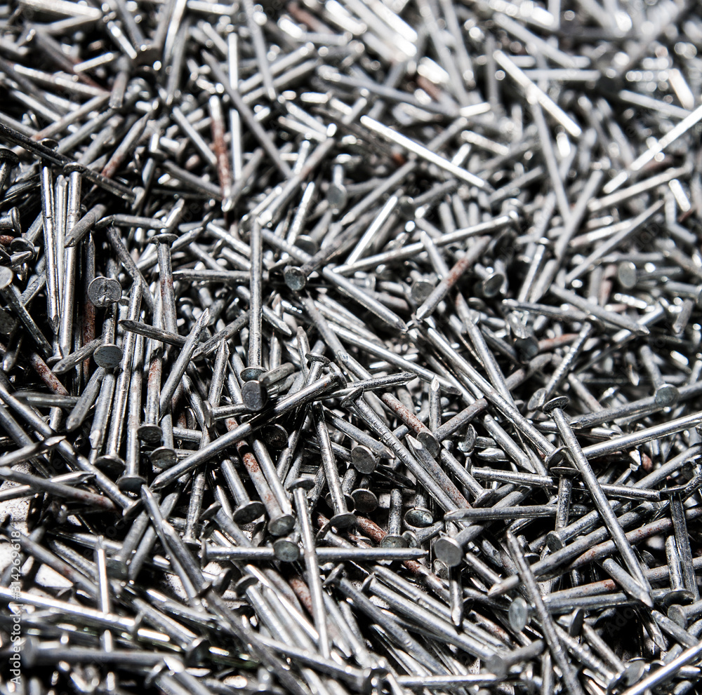 Metal shiny chrome nails background Metal shiny chrome nails background