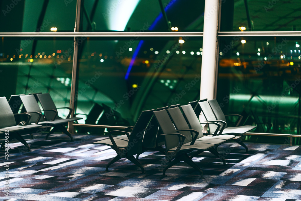 Chairs in modern airport terminal