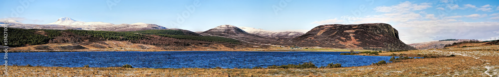 Loch Brora in winter, with Carroll Rock and snow on Ben Horn