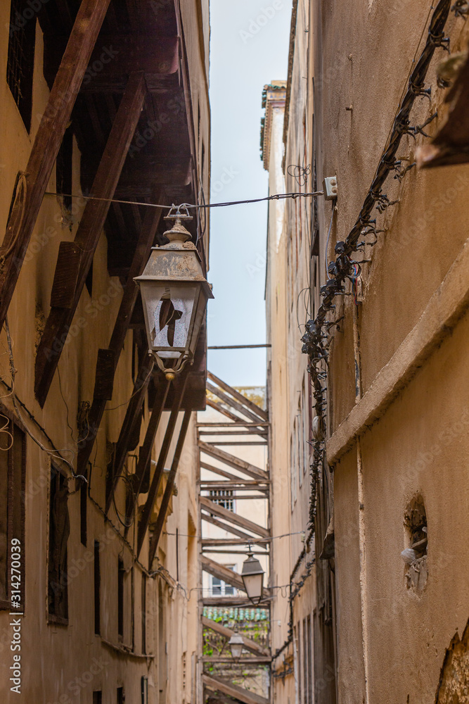 Old broken street lamp in the medina of Fes el Bali in Morocco
