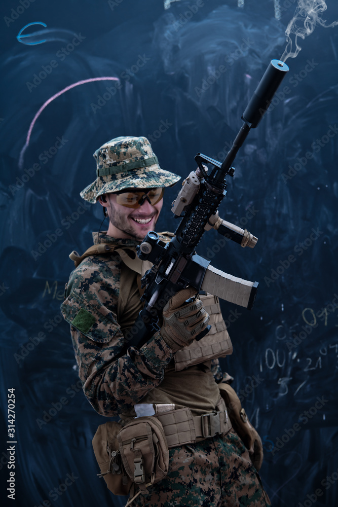 soldier firing into the air in front of black chalkboard soldier firing into the air in front of black chalkboard