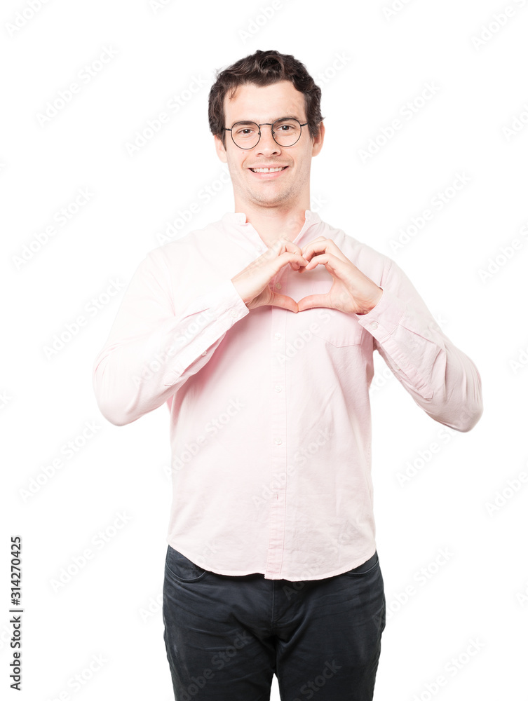 Happy young man doing a gesture of love with his hands Happy young man doing a gesture of love with his hands
