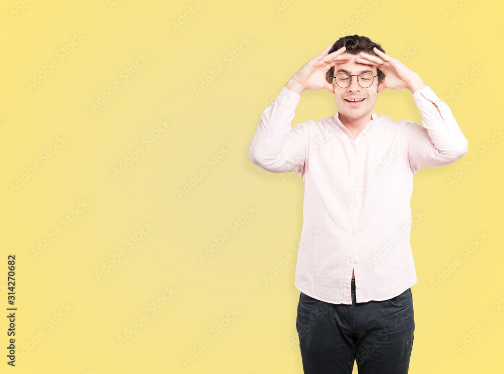 Happy young man with a gesture of looking away Happy young man with a gesture of looking away