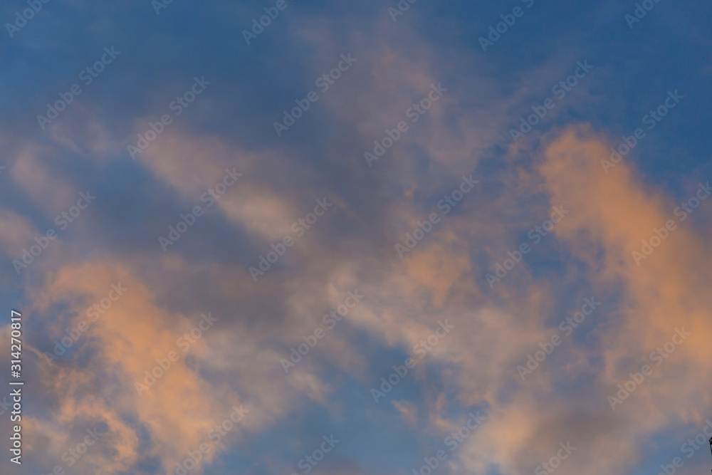 The sky is with clouds. Clouds have bright sunset colors. Moscow, Russia.