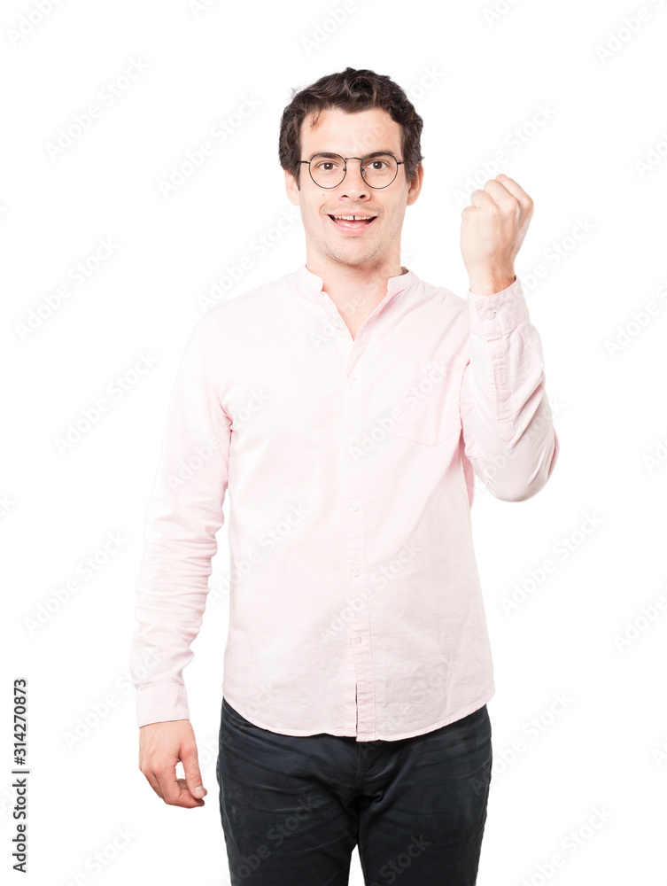 Happy young man doing a competitive gesture Happy young man doing a competitive gesture
