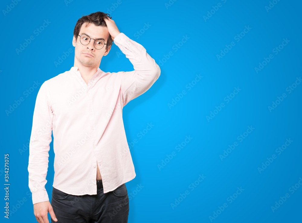 Serious young man with a gesture of disappointment Serious young man with a gesture of disappointment