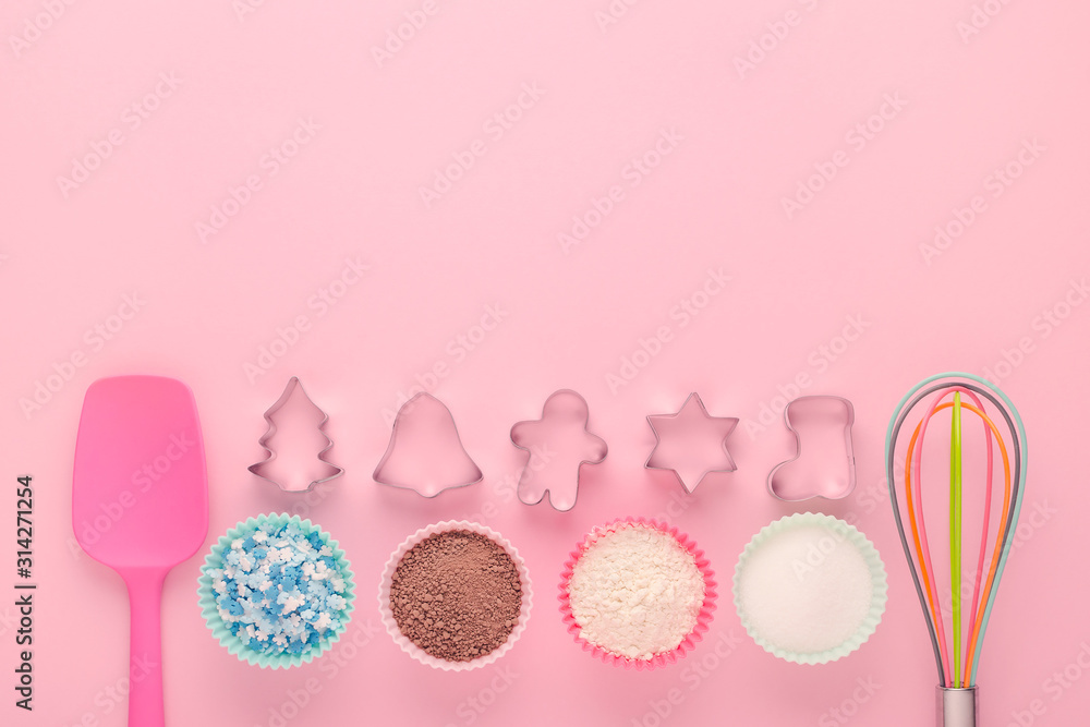 ingredients and cookie cutter on pink background, flat lay