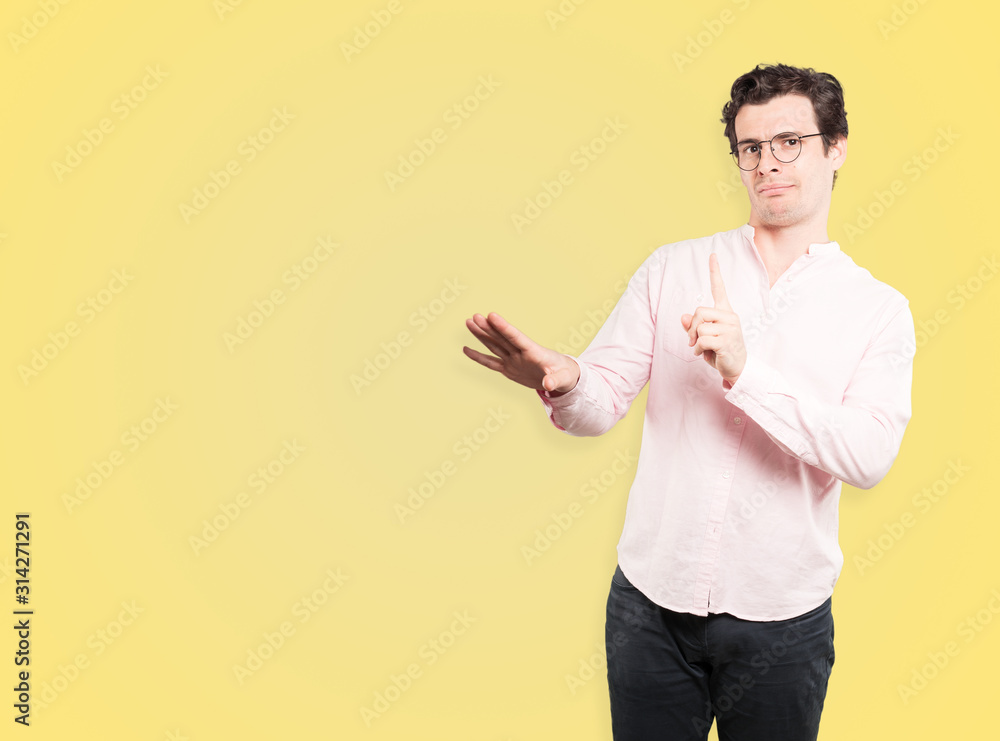 Haughty young man making a contemptuous gesture Haughty young man making a contemptuous gesture