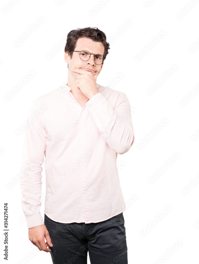 Concerned young man making a gesture of doubt Concerned young man making a gesture of doubt