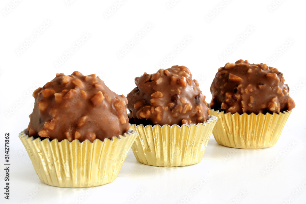 Homemade chocolate hazelnut balls on white background Homemade chocolate hazelnut balls on white background
