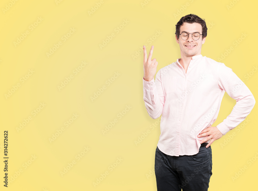 Young man making a number two gesture Young man making a number two gesture